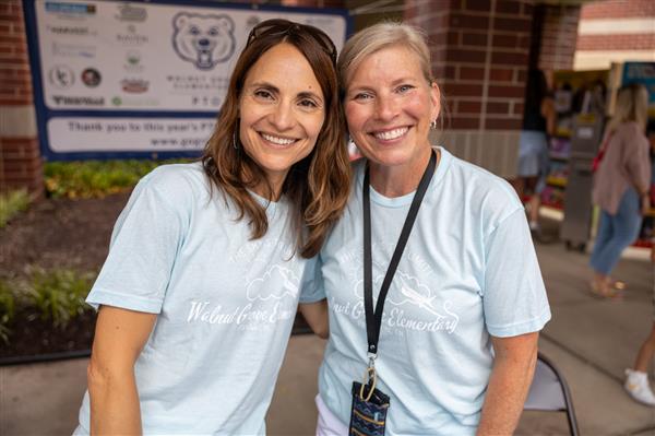 two teachers smiling